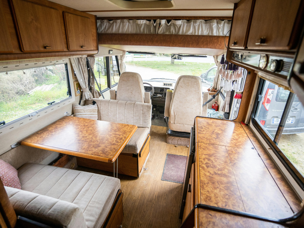 Freshly cleaned RV interior with polished woodwork and vacuumed upholstery